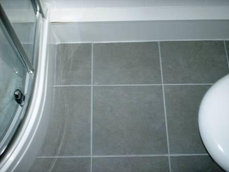 Grout Colour restored on a Ceramic Tiled Bathroom Floor by the Tile Doctor - After Picture