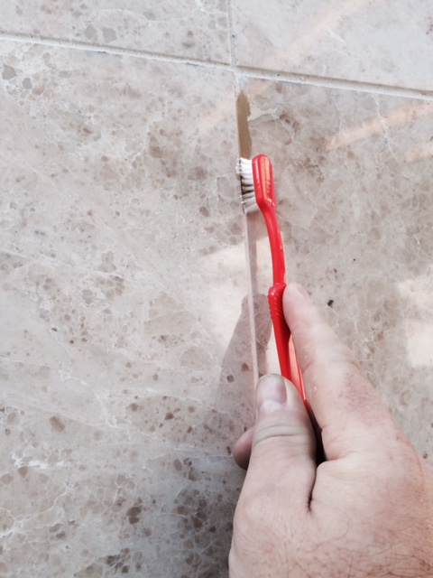 Step 5 - Brush the colourant onto the grout and wipe off the exceess Grout Colourant.