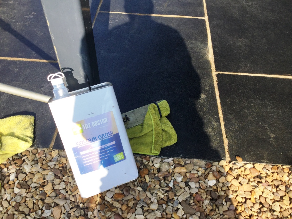 Black limestone patio in Walgrave sealed with Tile Doctor Colour Grow