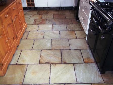 Picture shows how the sealer has brought out the colour in this Indian Sandstone kitchen floor.