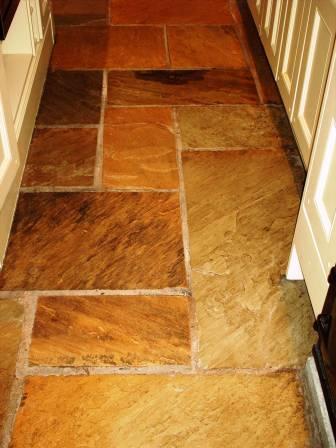 Picture shows how the sealer has brought out the colour in this Sandstone kitchen floor.
