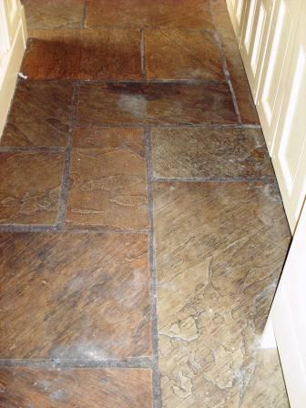 Picture shows Sandstone kitchen floor before cleaning and sealing